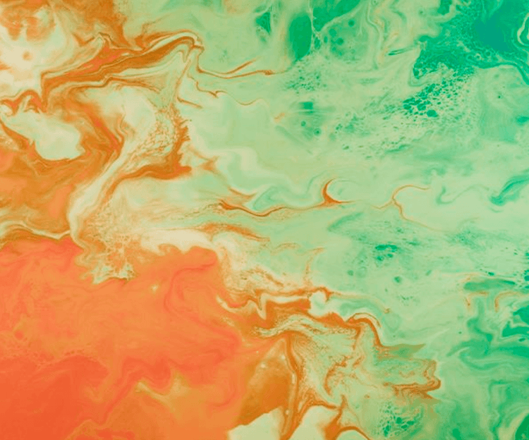 Abstract swirls of orange, light green, and teal paint creating a marbled pattern.