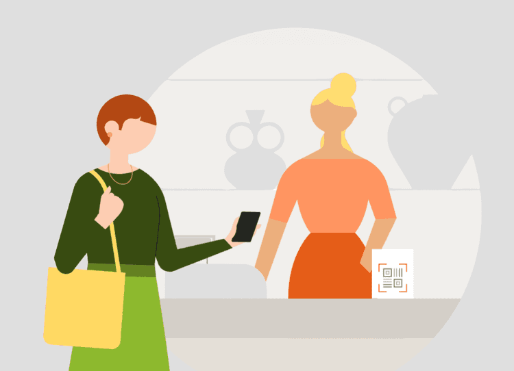 A customer pays with a smartphone by scanning a QR code held by a cashier.